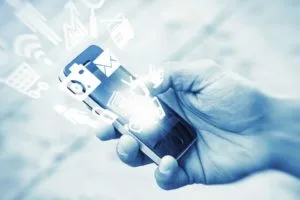 hand holding black mobile device