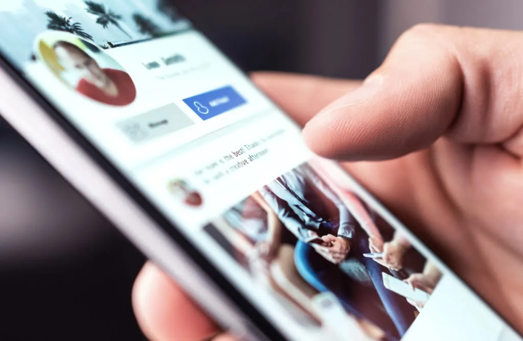 A person looks at a size-optimised image on a smart phone social media app