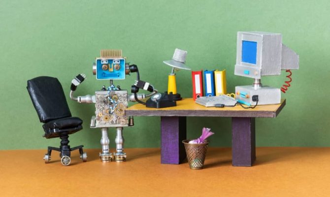 Small robot made from electronic parts with the word “ERROR” on its screen, representing AI for digital marketing issues.